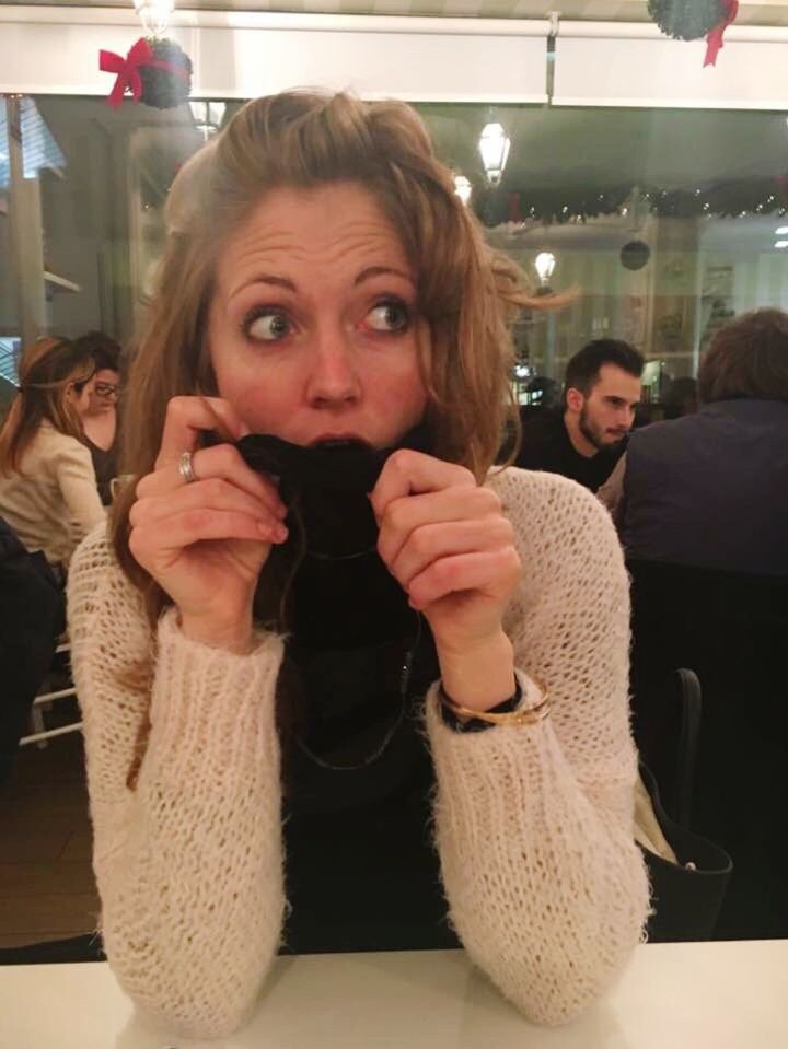 WOMAN SITTING ON RESTAURANT