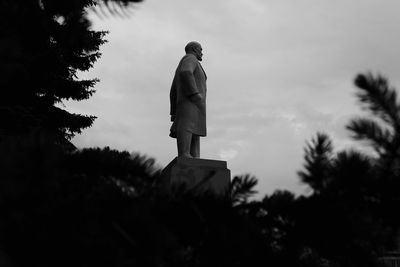 Low angle view of statue against sky