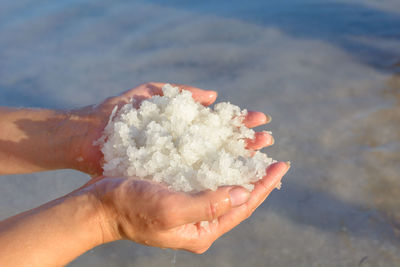 Close-up of hand holding ice cream