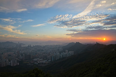 Panoramic shot of buildings against sky during sunset