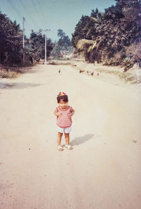 Rear view of woman walking on street