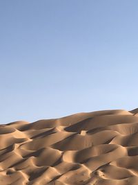 Scenic view of desert against clear sky