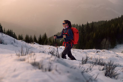 Hiking at sunset in the snow