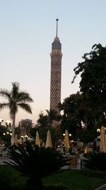 Tower in city against clear sky