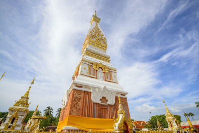 Low angle view of statue of temple against cloudy sky