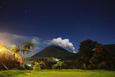 Scenic view of field against sky at night