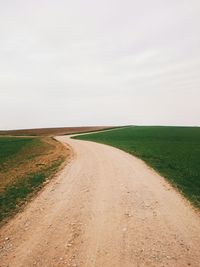 Road passing through field