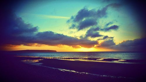 Scenic view of sea against sky during sunset