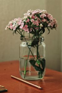 Close-up of flower vase on table