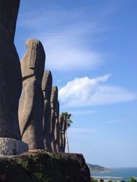 Side low angle view of ancient statues