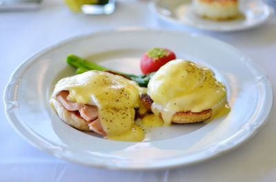 High angle view of eggs benedict served in plate on table