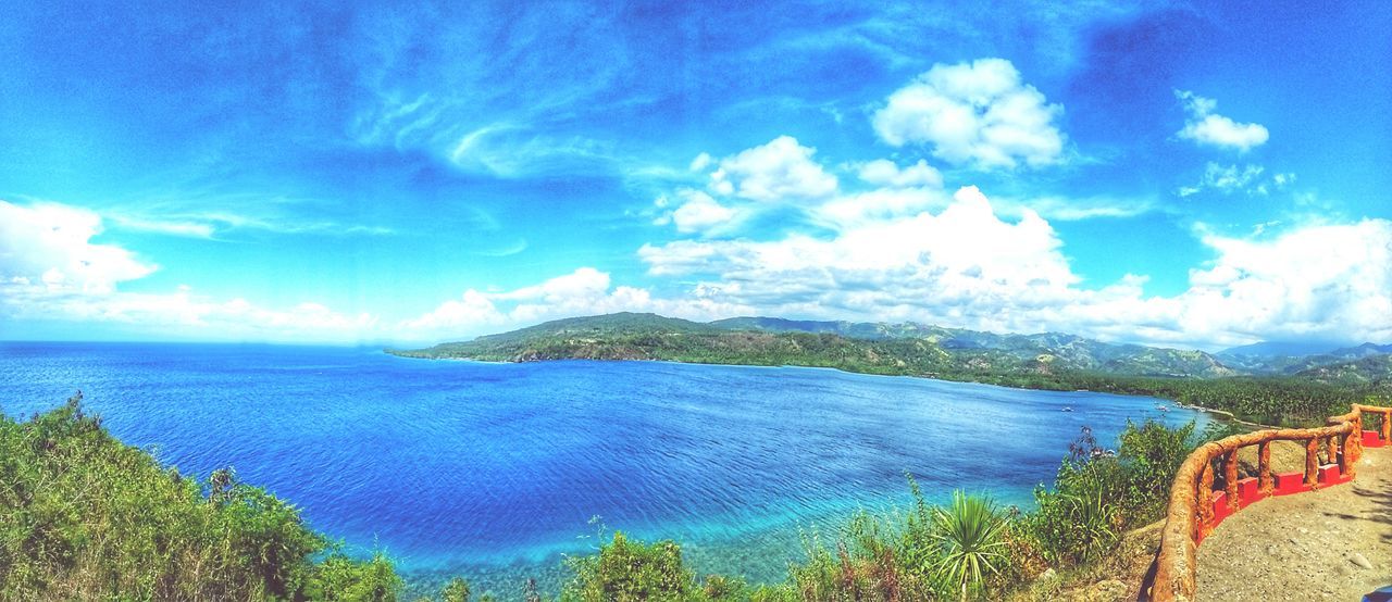 cloud - sky, sky, scenics - nature, water, beauty in nature, tranquil scene, tranquility, sea, nature, day, plant, blue, tree, land, no people, idyllic, beach, non-urban scene, outdoors, bay