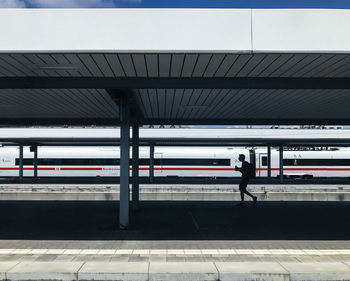 Man waiting at railroad station platform