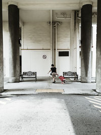 Woman pulling trolley