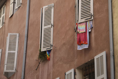 Low angle view of clothes drying on building