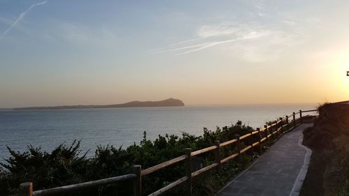 Scenic view of sea against sky at sunset
