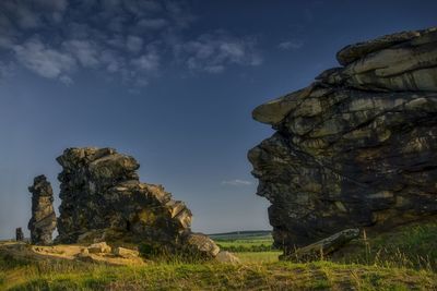 Rock formation on land against sky