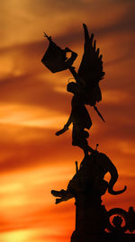 Low angle view of statue against sky