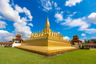 Temple building against cloudy sky