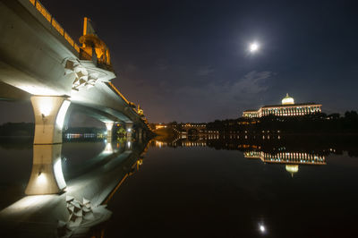 Reflection of illuminated buildings in water at night