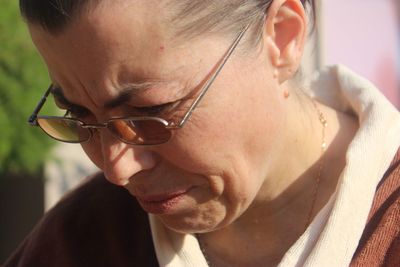 Close-up of mature woman wearing eyeglasses