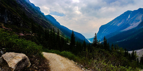 Panoramic view of land and mountains against sky