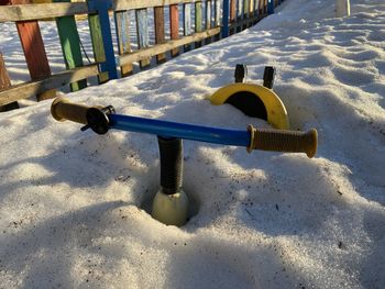 Playground in snow covered park