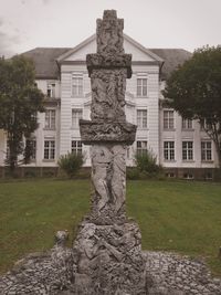 Close-up of statue against building