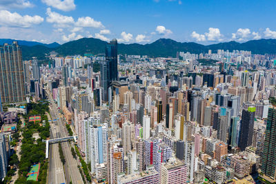 High angle view of modern buildings in city against sky