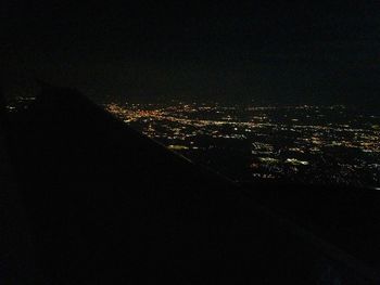 High angle view of illuminated buildings in city at night