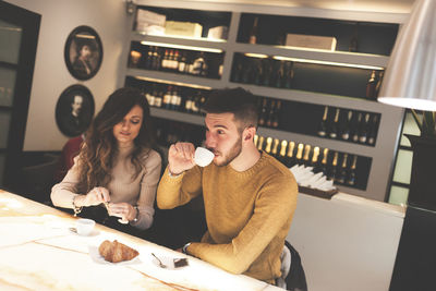 Couple having drink in cafe