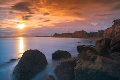 Beautiful beach panorama at sunset with beautiful cliffs in indonesia