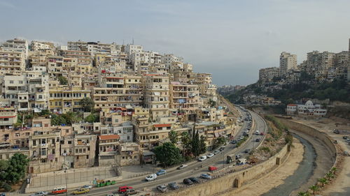 High angle view of buildings in city against sky