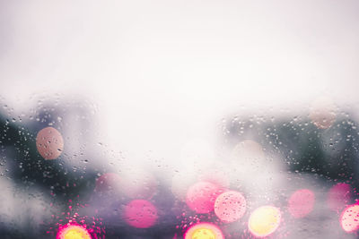 Close-up of raindrops on glass window