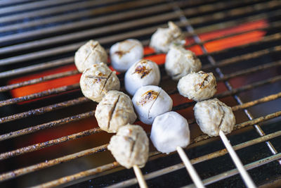 High angle view of meat on barbecue grill