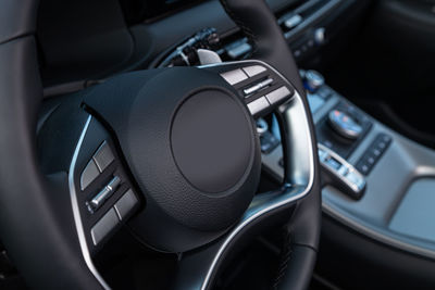 Close-up of steering wheel in car