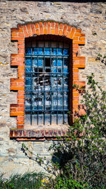 Close-up of window on brick wall