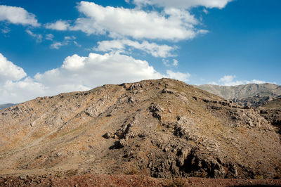 Rocky mountains with autumnal foliage and cloudy sky, rocky mountain khuzestan province, iran