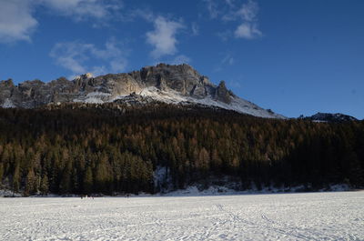 Scenic view of mountains against sky during winter