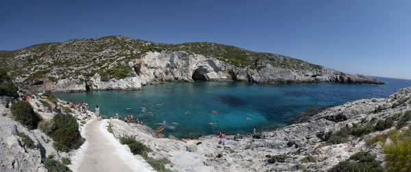 Scenic view of sea against clear blue sky