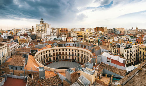 Aerial view of cityscape against sky