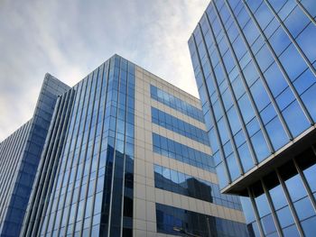 Low angle view of modern buildings against sky