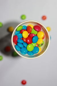 High angle view of multi colored candies on table