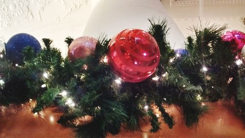 Close-up of red balloons on wall