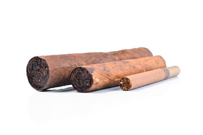 Close-up of cigarette against white background