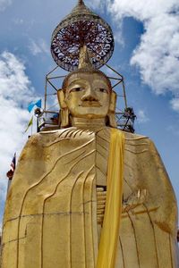 Low angle view of statue against sky