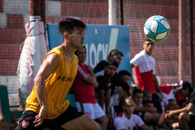 Group of people playing soccer ball