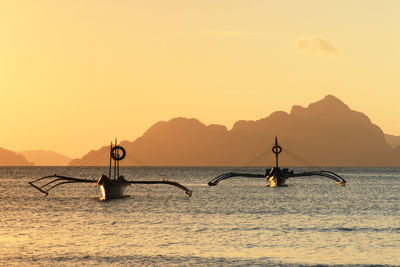 Scenic view of sea against clear sky during sunset