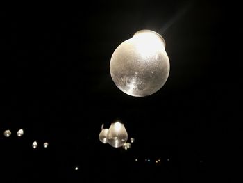 Low angle view of moon against sky at night