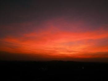 Scenic view of silhouette landscape against sky during sunset